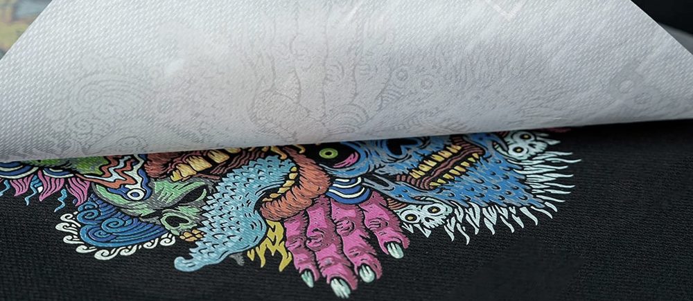 Peeling a DTF transfer onto a garment