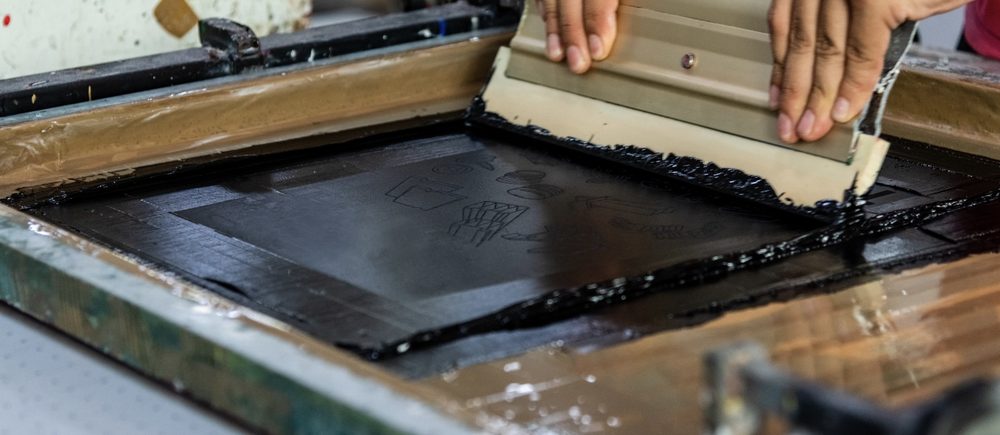 Screen printing a design by hand
